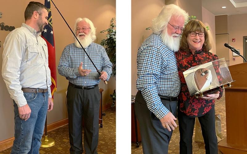 Left photo, Billy Boyd receives an engraved fishing rod from County Extension Coordinator Steven Patrick at his retirement breakfast. Right photo, the gifts keep coming, as Boyd gets a hug from Linda Henry after being told he will receive a football signed by Georgia coach Kirby Smart as a retirement present. MATTHEW OSBORNE/Staff