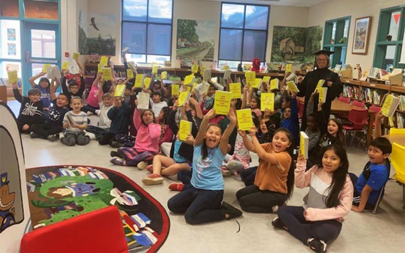 Students at Baldwin Elementary show off their new dictionaries presented by Volunteers for Literacy (VFL). The Dictionary Project is one of several VFL programs that promote literacy in Habersham County. PHYLECIA WILSON/Submitted