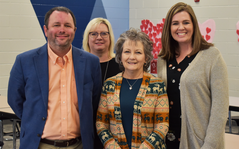 Hazel Grove paraprofessional Teresa Thomason saved a child’s life last week, and she was recognized for her heroism by Patrick Franklin, Director of Elementary Schools; Crystal Holcomb, Director of Nursing; and Principal Aimee Shedd. AMARIS E. RODRIGUEZ/Staff