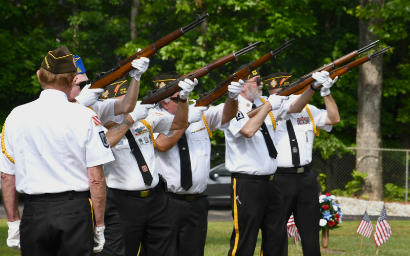 The honor guard for the Grant-Reeves VFW Post 7720 fires off the three-round volley at the Memorial Day  ceremony Monday morning. MATTHEW OSBORNE/Staff