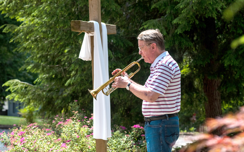Bobby Aycock plays Taps at Grace Calvary Church in Clarkesville on Monday afternoon to honor those who have lost their lives in service of their country. E. LANE GRESHAM/Special