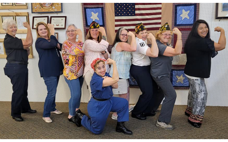 Veterans celebrated with Rosie the Riveter (Carol Cain) at a luncheon at the Grant Reeves VFW Post 7720 headquarters in Cornelia on May 22. From left are Brandy Creel, Amanda Doughty, Renee Turner, Gabrielle Buetler, Lisa Memars, Janita Mastin, Connie Barrow and Irma Van Norman. MICHELLE CHEESMAN/Submitted