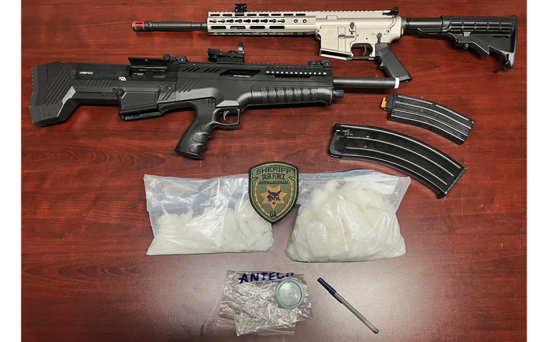 Drugs and guns were seized from four suspects in a drug arrest last week. TRENT HILLSMAN/Submitted