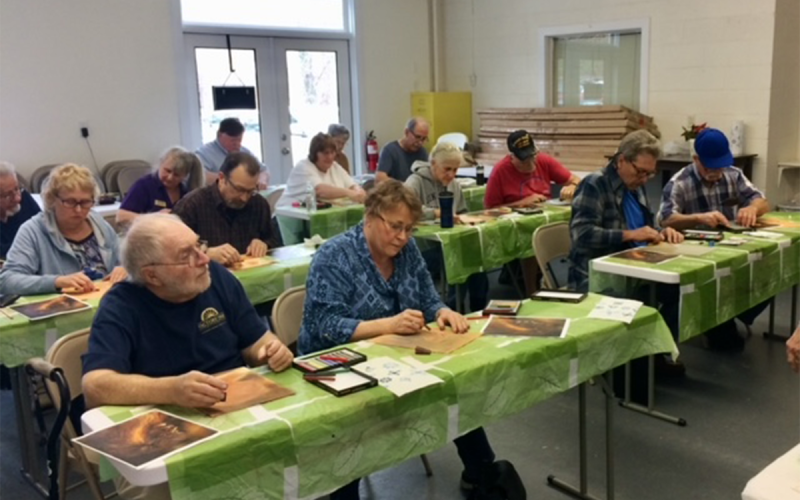 Veterans work on a project in art classes at the Helen Arts Center. RON HILL/Submitted