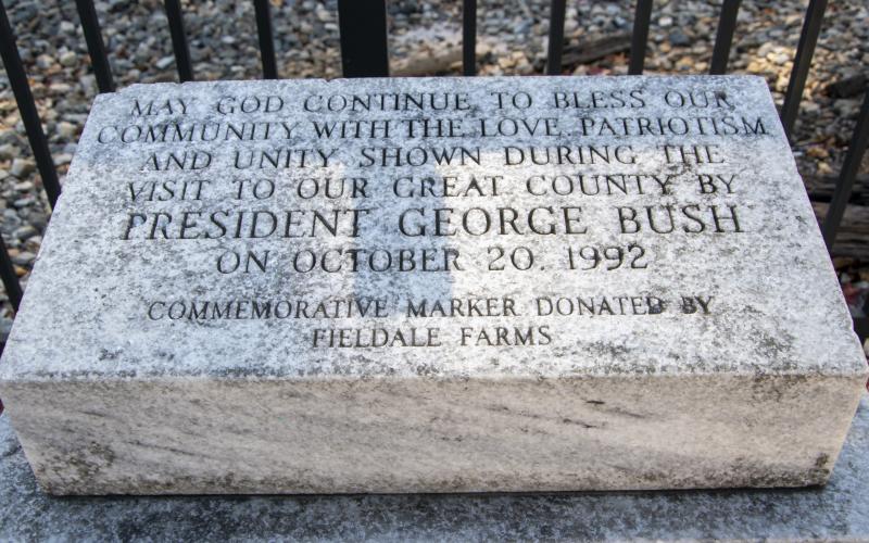 A granite marker, commemorating President George H.W. Bush’s visit to Cornelia, is outside the Cornelia Train Depot. KIMBERLY BROWN/Staff