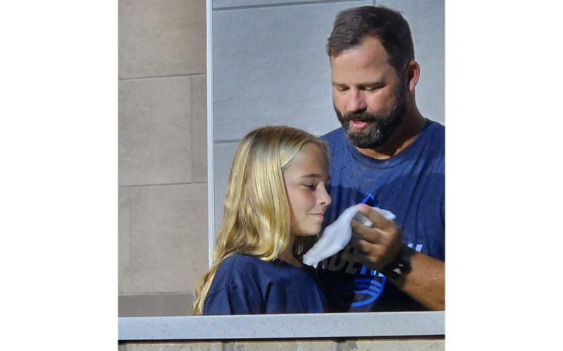 Malin Littlejohn, 10, daughter of Leah Thibeault and Wesley Littlejohn, is baptized by the Rev. Brian James at Level Grove Baptist Church on Oct. 2. Malin was one of 32 people baptized Sunday at the church’s first service in its new sanctuary. SUBMITTED
