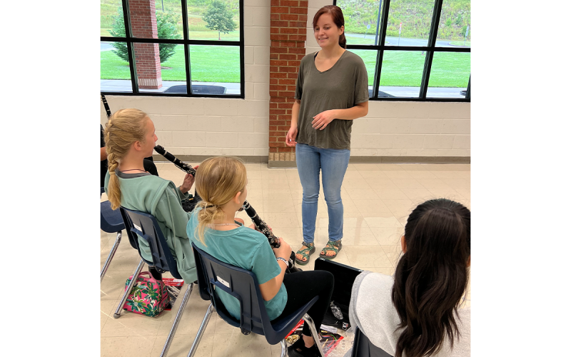 Ada Blalock, Payson Holcomb and Emilee Juhasz practice the clarinet with instruction from Mattie King. NANCY SIMMONS/Submitted