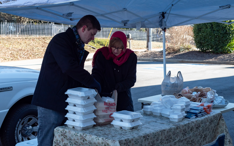 Sean and Cameron Nix prepare meals for drive-thru customers in the freezing cold. E. LANE GRESHAM/Special 