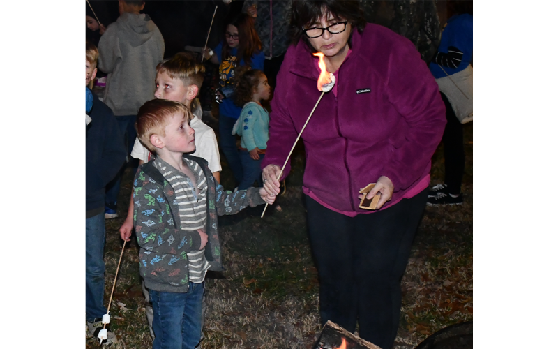 Oliver Trigg needed help to put out the fire on his marshmallow at Baldwin’s Christmas celebration. MATTHEW OSBORNE/Staff