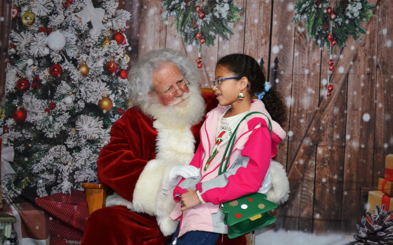 McKayla Lane consults with the big man himself, Santa Claus, in Clarkesville. SAMANTHA SINCLAIR/CNI News Service