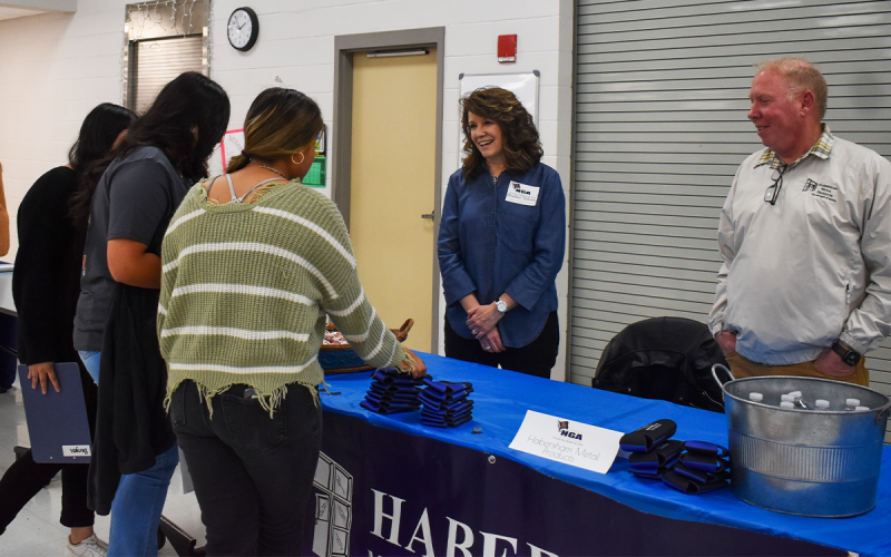 Many organizations and colleges brought free goodies to hand out to the students, and Habersham Metal Products is no different. Heather Thieme and Collin Miller handed out candy, Koozies and water for students to remember their organization. EMMA MARTI/Staff