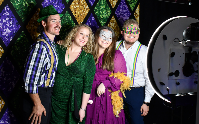 From left, Eric Challenger, LeAnne Challenger, Marcia Hamil and Noah Hamil pose for pictures at the photo booth. SAMANTHA SINCLAIR/CNI News Service