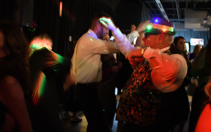 Eddie Gonzalez and his wife Kaye get down on the dance floor under the illumination of Eddie’s festive hat. SAMANTHA SINCLAIR/CNI News Service