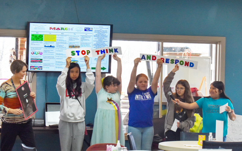 Demorest Elementary students Arielle Kinnarath, Isabella Beauchamp, Sophia Garcia, Allison Maichryc and Leslie Carranza alongside mentor Michelle Rylee teach about the STAR response of self-control, telling people to Stop, Think And Respond at the Senior Center on Tuesday.  EMMA MARTI/Staff
