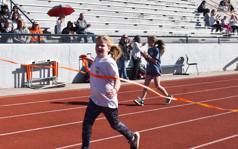 Fairview Elementary athlete Hannah Brank crosses the finish line in her heat of the 100-meter dash. EMMA MARTI/Staff