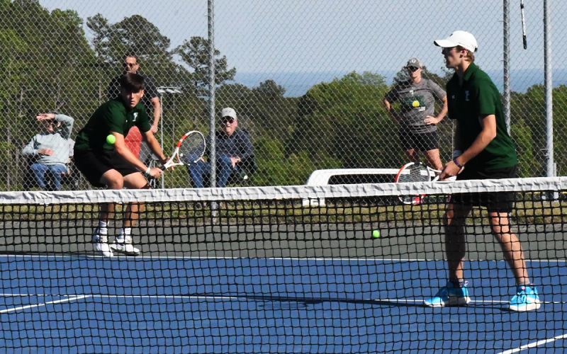 Tallulah Falls’ Zach Carringer (left) returns a shot while doubles partner Jake Owensby stays ready for the response during Monday’s state playoff match. LANG STOREY/Staff