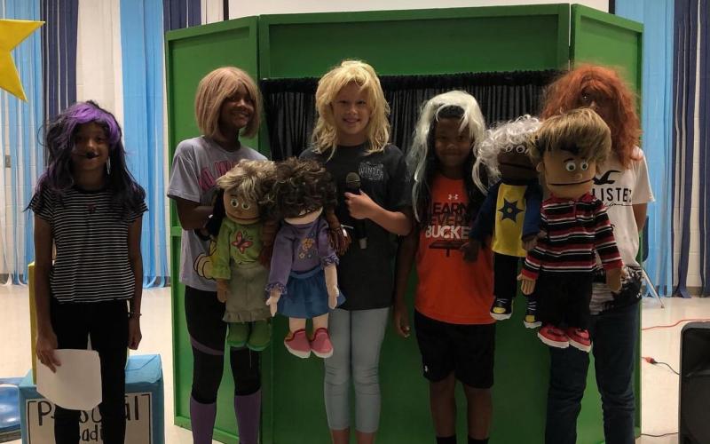 Cornelia Elementary students  London Garcia, Tinsley King, Ali Hartrick, Ty King and Steve Hernandez Mora pose with their puppets as part of a Leader in Me project. SUBMITTED