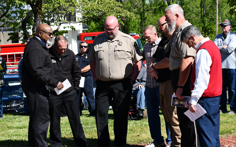 Shown during the prayer for law enforcement in Clarkesville are (from left) Pastor Benjamin L. Hawks, Greg Chastain, Les Hendrix, David Stancil, Justin Williams, Sheriff Joey Terrell and Pastor Keith Cox. They prayed for Terrell, his office and the work his deputies do every day. JOHN DILLS/Staff