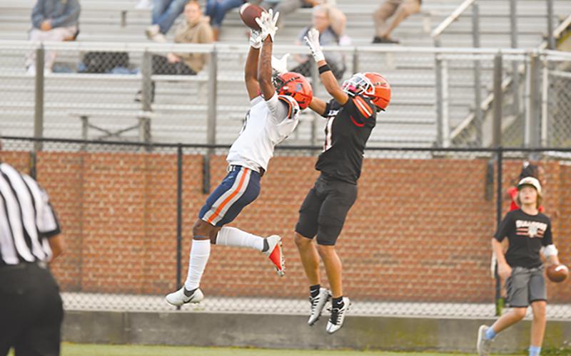 Habersham Central's Somdee Satiphone Jr. goes airborne for a pick against Hartwell. TOM ASKEW/Special