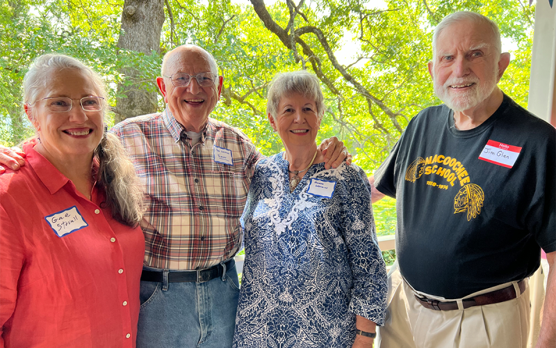 Gae Stovall (wife of Ike), alum Sonny (Paul) and Milene Watkins and alum Jim Glen gather on the front porch of the Community Hall. IVY RUTZKY/Submitted