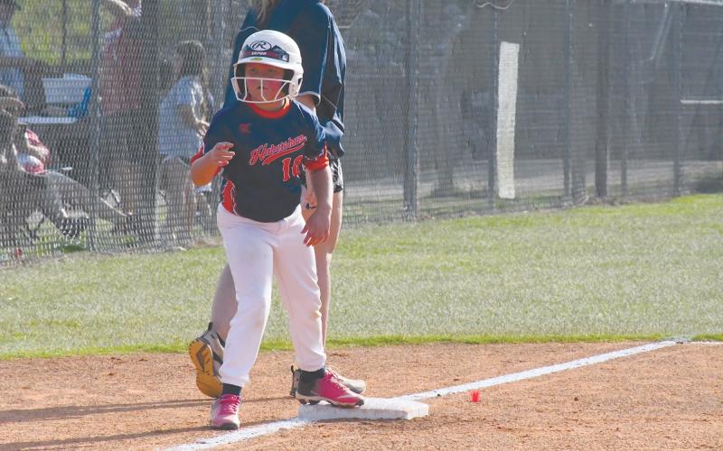McKinley Dodd waits for the chance to break for home during the 8-U tournament.