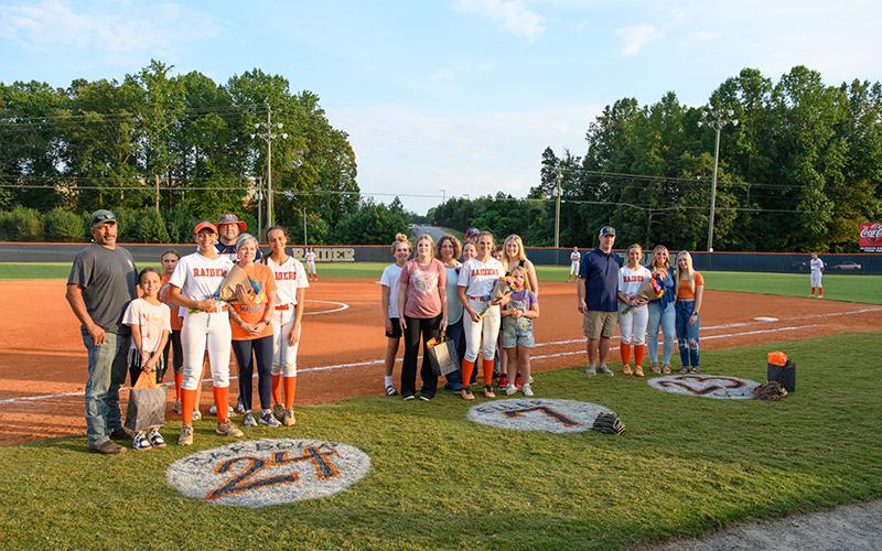 Pictured (left to right) Charli Barbour, Kayton Eller, and Hannah Odum stand with their families on senior night. ZACH TAYLOR/Special