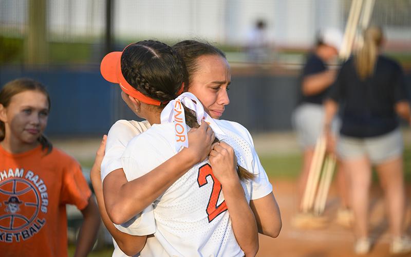 Sisters Charli and Brooke Barbour embrace after the senior night ceremony Thursday night. ZACH TAYLOR/Special