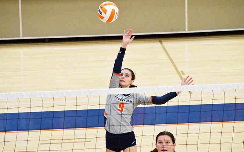 Habersham Central’s Maci Williams gets up high to play the ball during a recent home match. LANG STOREY/Staff