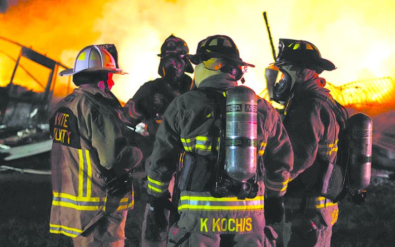 Director David Murphy, Firefighters Will Sexton, Kevin Kochis, and Jordan LeFevre talk amidst the flames. WHITE COUNTY/Submitted