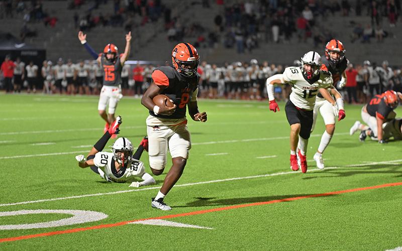 Habersham Central ‘s DJ Pass (15) calls touchdown as  teammate Antonio Cantrell breaks into the open during Friday’s game. TOM ASKEW/Special