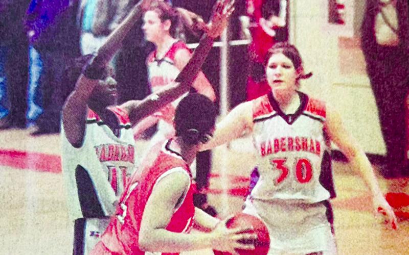 Habersham Central’s Sheena Trimiar (left) helps teammate Megan Teague pressure a Hart County ball handler in 2003. FILE