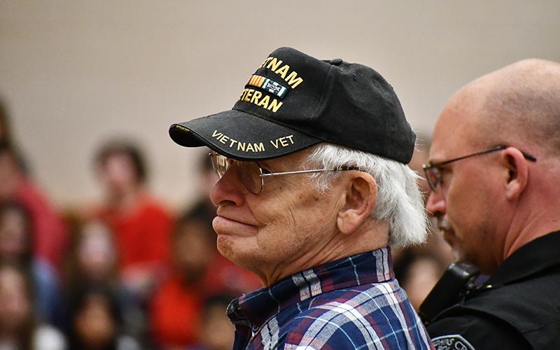 Vietnam War Veteran Robert Tate proudly stands during “March of the Armed Forces” at South Habersham Middle School’s Veterans Day Program on Thursday. His wife Eileen M. Tate and son are also veterans. JULIANNE AKERS/Staff