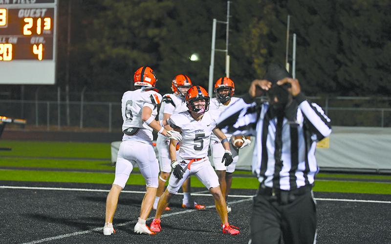 Habersham Central’s Zeke Whittington and Jonah WIlson help celebrate Donnie Warren’s touchdown on Friday night as the Raiders topped Shiloh. TOM ASKEW/Special