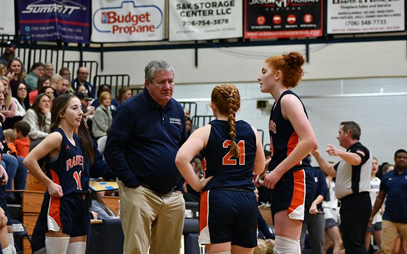 Lady Raiders coach Bill Bradley gives instructions to his players Friday against White County, including (from left) Kylie Littlejohn, Karah Dean and Daytona Underwood. LANG STOREY/Staff