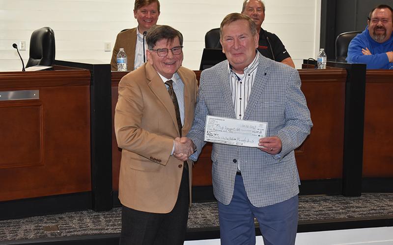 Demorest Councilman Dr. John Hendrix accepted a $5,000 donation for the Demorest Park Committee from Habersham County Vice-Chairman Bruce Harkness. MATTHEW OSBORNE/Staff
