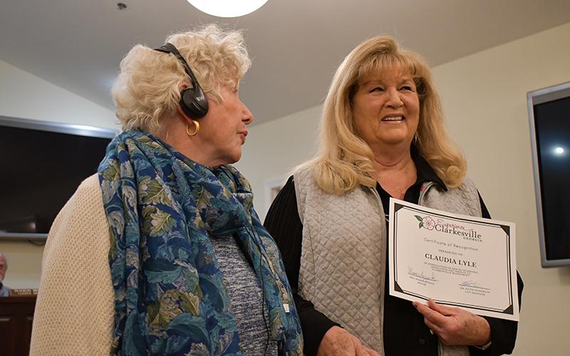 Mayor Barrie Aycock, left, recognizes Claudia Lyle, the longest serving member of the Main Street Board. JULIANNE AKERS/Staff