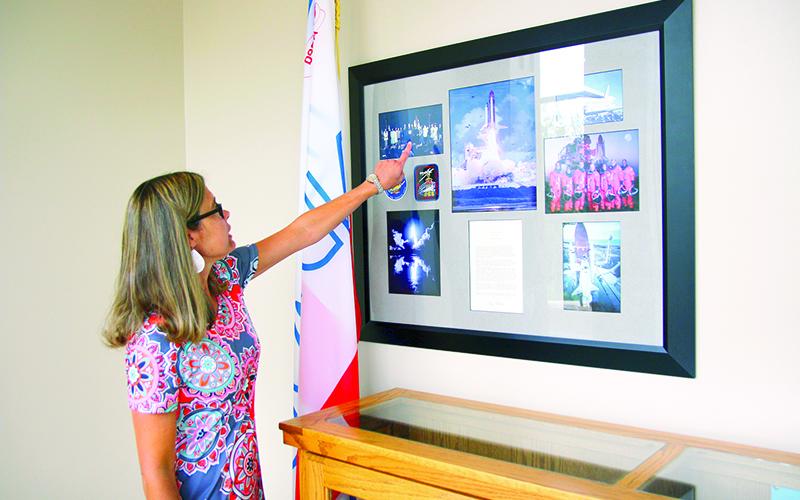 Tallulah Falls School Upper School Academic Dean Kim Popham observes the many keepsakes reminiscing when students and faculty won the opportunity to travel to the White House. FILE