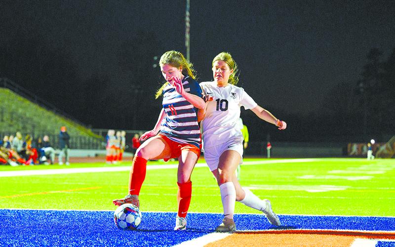 Habersham Central’s Ansley Means fights toward the goal box against Flowery Branch’s Rylee Evans on Tuesday night. ZACH TAYLOR/Special