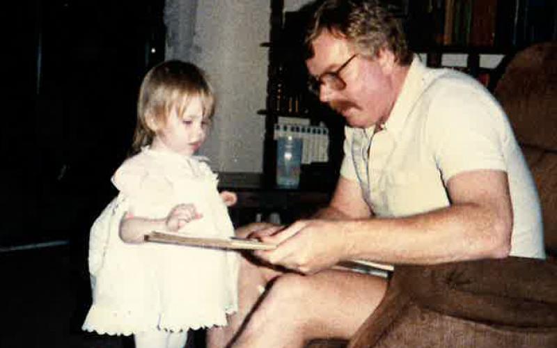 Pops reads with Kenz way back in the day.