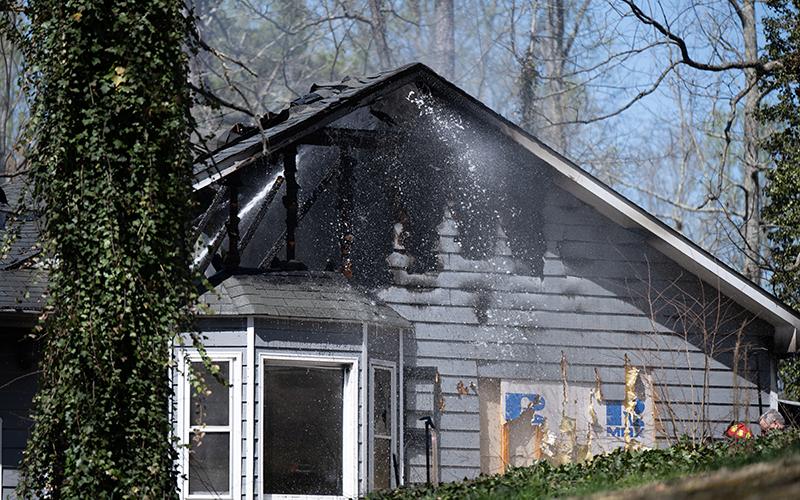 Firefighters hit the roof with another blast of water. ZACH TAYLOR/Special
