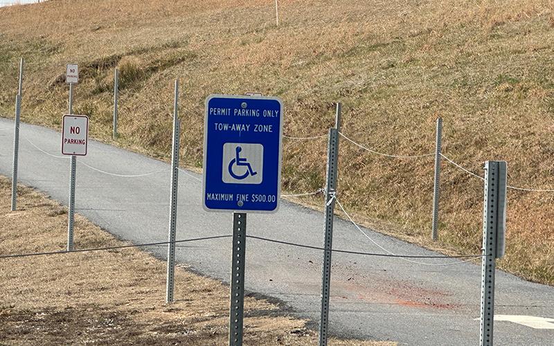 Parking at the ballfields has often been an issue (above), so new cables were added to the handicapped parking area to prevent illegal overflow parking. HABERSHAM COUNTY/Submitted