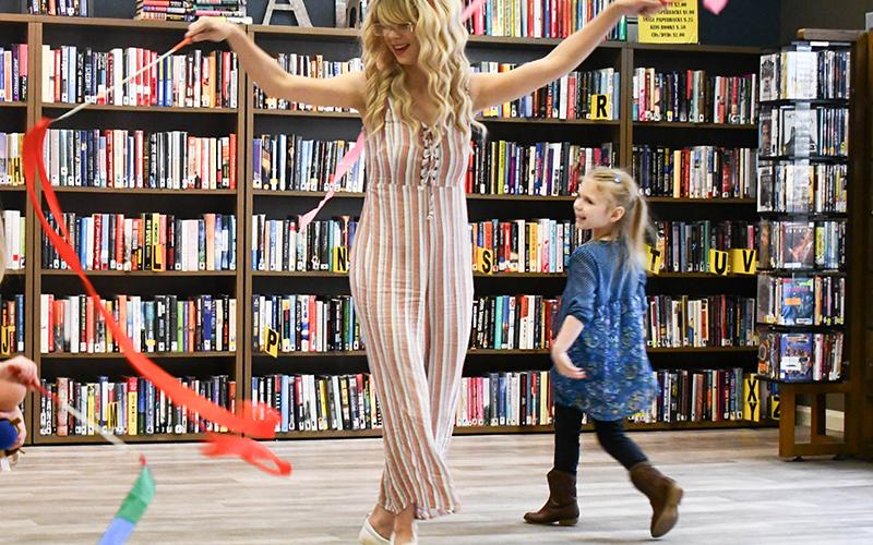 Magic Movements and Music Class Instructor Alexis Lowe, left, twirls ribbons with her daughter Stacy Grace Wratchford, right. JULIANNE AKERS/Staff