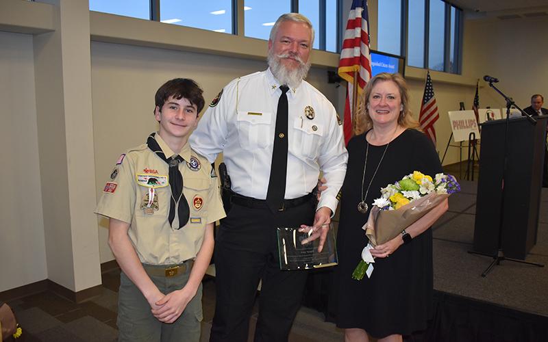 Troop 5 Scout Kav Stapleton greeted the award winners Tuesday, Sheriff Joey Terrell and wife Darlene (right photo). MATTHEW OSBORNE/Staff