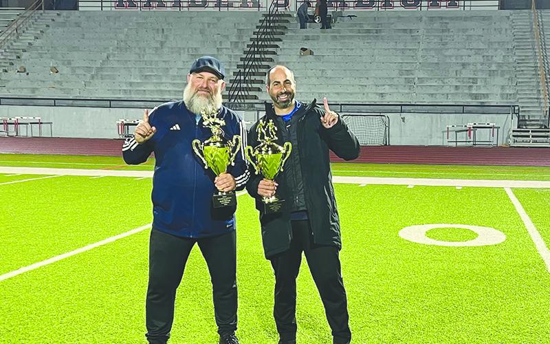 Raider boys coach Ric Wallace and girls coach Jeff LaBarbera take a  moment to celebrate their collective achievements this season. AMY HOOD/Submitted