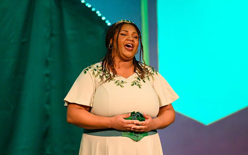 Arabia Jones plays the Princess Who Kissed The Frog and sings the song “Finally,” written by Dennis Giacino. The song celebrates The Princess’s becoming the first black Disney princess after 100 years of production. ZACH TAYLOR/Special