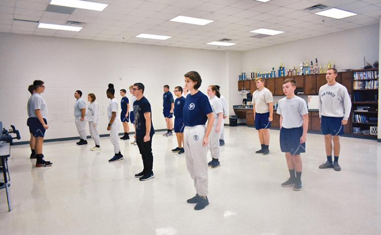 Students lead the class with stretch exercises to start off physical training, which the Air Force Junior Reserve Officer Training Corps at Habersham Central High School has every Friday.