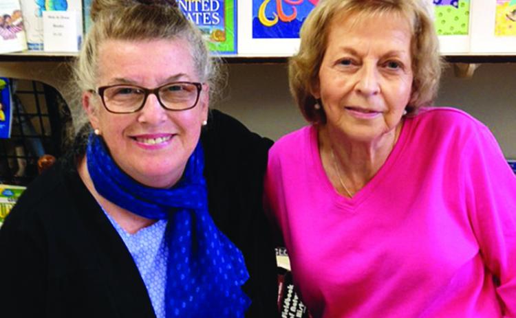 Director of the Children’s Art Gallery Jan Walker, left, poses with the late Glenda Boling. Boling supported several local authors and artists while operating Books with A’peal.