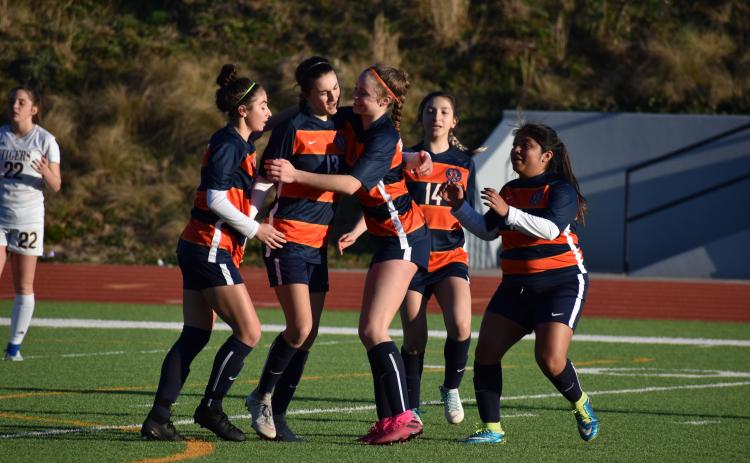 Habersham Central’s Anna LaBarbera, from left, Addie Penick, Sydney Turner, Abigail Deleon and Maria Miguel celebrate a goal from Penick during the second half of the Lady Raiders 5-2 victory over Dawson County High School Friday.