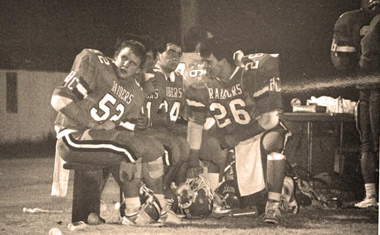 had Radcliffe (26) consults with teammates A.J. Eash and Eric Hooper during a time out from a Habersham Central game in 1987. 