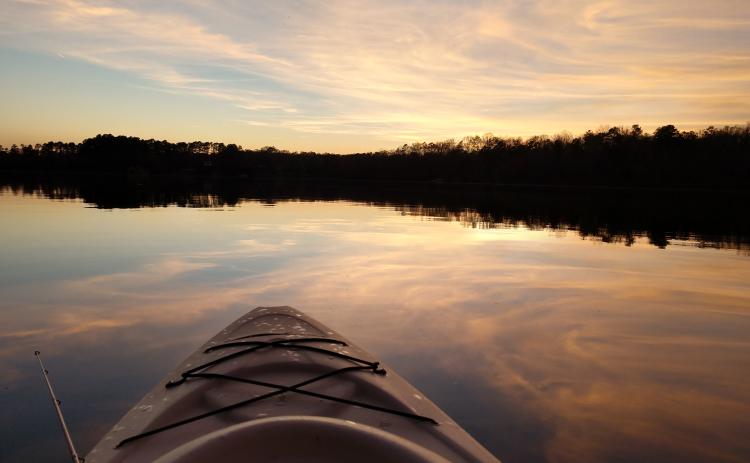 Michael Hall / Seen from a kayak, Lake Hartwell is beautiful in the sunset.